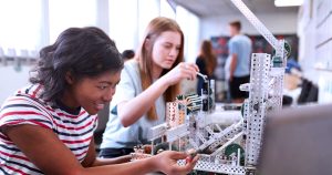 Two female students working on a project together