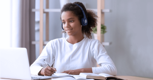 A girl studying on a laptop. 