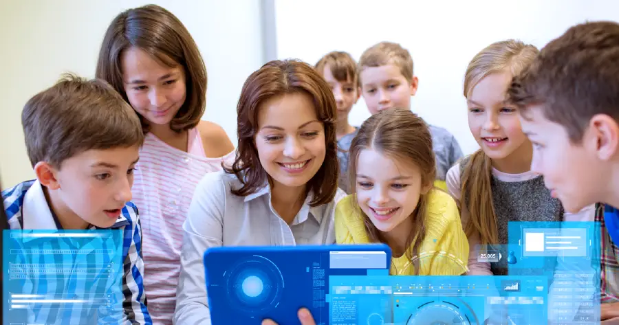 A group of teachers and students looking at a tablet. 