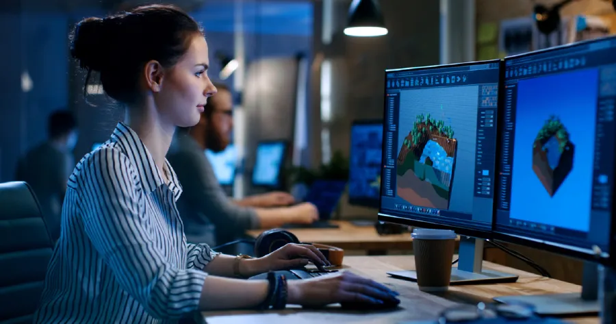 A woman working on a desktop computer. 