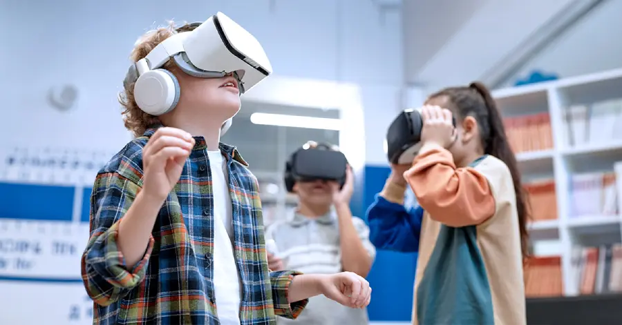  An excited white boy wearing a VR experiencing 360 Degree Learning