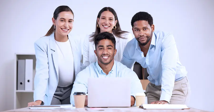 A multiracial group of leaders discussing how the integration of AI in a learning platform can lead to efficient career mobility for employees.