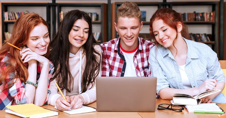 A group of college learners learning about the benefits of cloud computing in education.